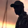 Profile photo of Mateo Garcia, a man wearing a cap and standing outdoors at sunset.